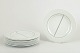 Stig Lindberg for Gustavsberg, plates. Set of eight.Flat faience plates with white glaze and ...