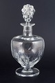 René Lalique, Clos Vougeot decanter.Large and rare wine decanter in clear moulded glass with ...