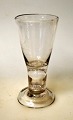 Masonic glass. Conradsminde, 1834 - 1857, Denmark. Clear glass with bent foot and hollow stem. ...