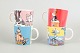 Set of four Moomin Arabia mugs.Porcelain mugs decorated with colourful illustrations from the ...