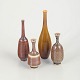 John Andersson for Höganäs, set of 4 miniatures vases.Small thrown stoneware vases with ...