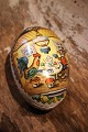 Old vintage Easter egg in papier-mâché with a motif of an Easter bunny and a chicken drinking ...