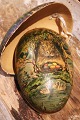 Vintage Easter egg in papier-mâché from the early 1900s with a motif, on one side a rabbit ...