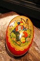 Old Easter egg in painted cardboard from the early 1900s with a motif of an Easter bunny ...
