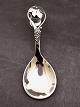 Silver serving spoon with grape motif