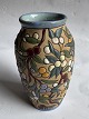 Arguado Toledo ceramic vase with colorful enamel leaf and berry decoration around the vase. The ...