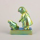 Zsolnay, girl with chicken in eosin glaze.Decorative figural group in faience with iridescent ...
