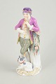 Meissen figurine, nobleman with flute and dog.Porcelain figurine depicting a standing nobleman ...