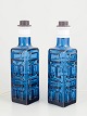 Pukeberg, pair of Swedish art glass table lamps.Pair of table lamps in blue pressed glass with ...