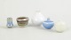Set of five miniature ceramic bowls and vases.Collection of five miniature ceramic pieces ...