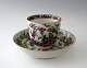 Famille rose cup, China, 19th century. With saucer. Polycrom decoration with roses, birds and ...