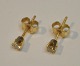 Pair of 14K earrings with small diamonds. 20th century. Stamped. Diamonds 1/16 carat.