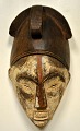 African carved wooden mask, early 20th century. Made of wood with painting. H: 37 cm. W: 21 cm.