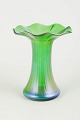 Loetz iridescent glass vase.Elegant vase in mouth-blown glass with a wavy flaring rim and a ...