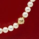Per Borup; A pearl necklace with clasp in 14k white gold