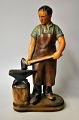 Carlsen, Paul Hauch (1922 - 2006) Denmark: A blacksmith. Painted plaster. Stamped. H: 30 cm.