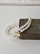 Two-strand cultured pearl bracelet with clasp in 18 kt gold