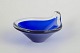 Murano, bowl.Organically shaped glass bowl in deep blue glass with clear rim and softly ...