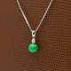 A necklace in 14k white gold, with pendant in 18k white gold set with a jadeite and a diamond, ...