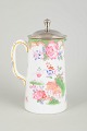 Royal Doulton "Temple" pitcher with lid.Decorative porcelain pitcher with colourful floral ...