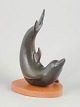 Gunnar Nylund for Rörstrand, dolphin figure.Stylised dolphin executed in stoneware with a soft ...