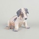 Dahl Jensen, porcelain dog figurine.Naturalistically modelled porcelain figure of a seated dog ...