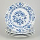 Meissen Blue Onion, set of four dinner plates.Set of four classic porcelain dinner plates with ...