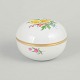 Meissen, lidded jar with polychrome flower decoration.Porcelain lidded jar hand painted with ...