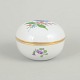 Meissen, lidded jar with polychrome flower decoration.Round porcelain lidded jar hand painted ...