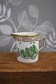 Creamer in Flora Danica set produced by Royal Copenhagen in Denmark. H: 7cm. Dia: 5.5cm. The ...