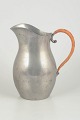 Just Andersen, large pitcher in pewter.Large pitcher in pewter with wicker handle and softly ...