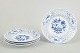 Meissen Blue Onion, set of four plates.Set of four porcelain plates featuring the classic ...