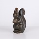 Ceramic squirrel figure by Knud Basse made in dark glaze with warm brown tones. The figure ...