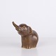 Elephant figure by Knud Basse made in brown glazed ceramic. The figure is modeled with raised ...