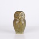Owl figure by Knud Basse made in glazed ceramic with greenish tones and dark decoration. The ...