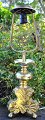 Baroque church candlestick in brass, 18th century. Tripod decorated with rocailles. Converted to ...