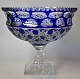Large crystal centerpiece, 20th century. With blue rim. On a square base. H.: 21 cm. Dia.: 24 cm.