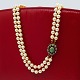 A double pearl necklace, with clasp of 14k white gold and gold, adorned with diamonds and an ...