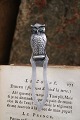 Old silver bookmark in the shape of a small owl with green glass eyes. Stamped 830s. Length: 8.6cm.