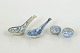Two spoons and two miniature lidded bowls, Qing dynasty.Two porcelain spoons with blue ...