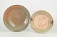 Two dishes, Qing dynasty.Two ceramic dishes, including one larger example with celadon glaze ...