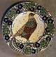 Large earthenware dish from Aluminia, decorated by Christian Joachim with a motif of a golden ...