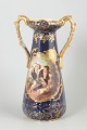 Faience vase with romantic scene.Tall baluster-shaped faience vase with deep cobalt blue ...