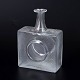 Tapio Wirkkala for Iittala, glass bottle.Heavy square glass bottle with integrated circular ...