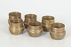 Set of six brass cups.A set of six small brass cups with a simple cylindrical form, produced ...