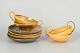 Kähler, set of four teacups with matching saucers.