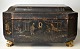 Chinese sewing box in lacquer with paintings, 19th century. Baroque shape. On four lion feet of ...