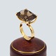 Ulla Kampmann; Ring in 14k gold set with a topaz