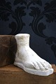 Decorative, old plaster cast of foot with fine patina. H: 15.5cm. L: 22cm.