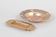 Two brass ashtrays.Decorative brass ashtrays, comprising one circular ashtray with engraved ...